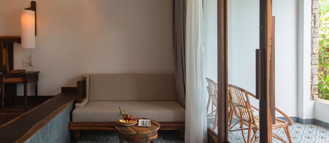 A sofa near the balcony of our hotel room - Alibu Resort Nha Trang