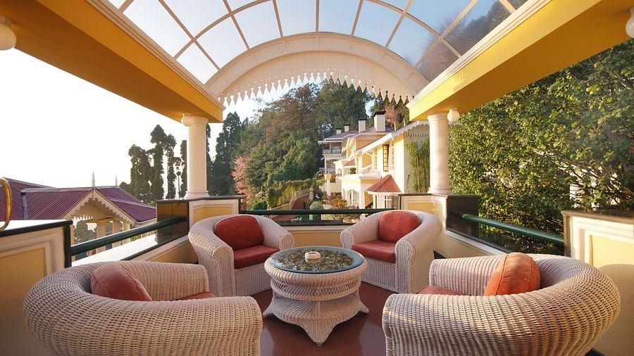 sofa seats inside the atrium - Mayfair Hill Resort, Darjeeling