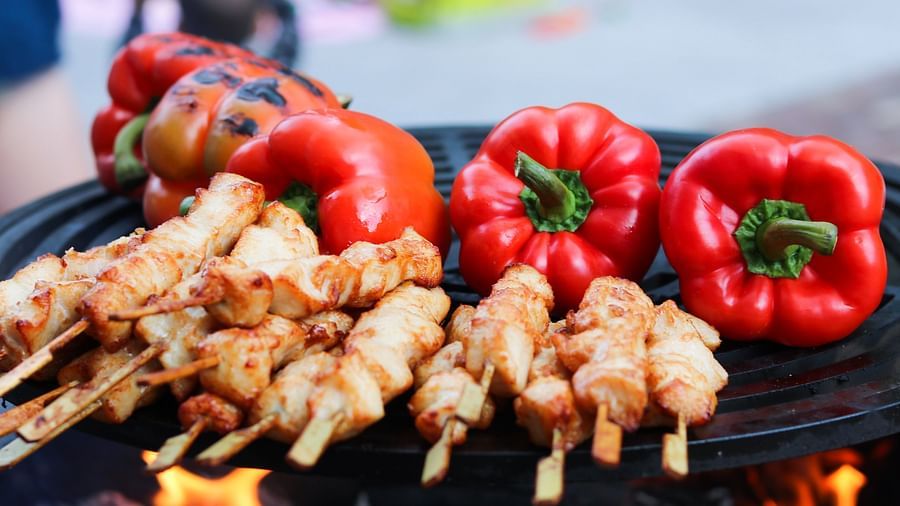 grilled food in a plate with red bellpepper 