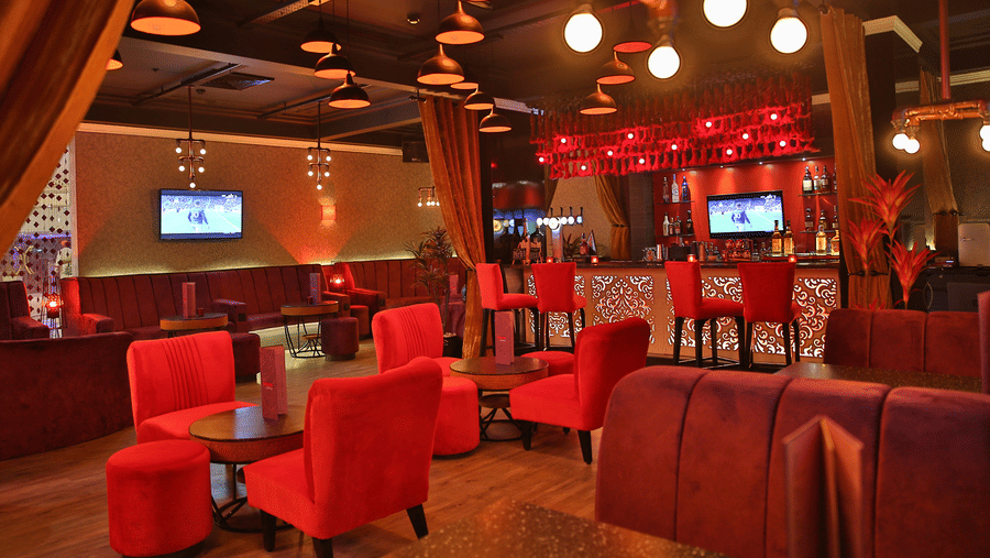 Passion Lounge interior with plush seating, warm lighting and a vibrant ambience, ideal for relaxed evenings, drinks and casual conversations.