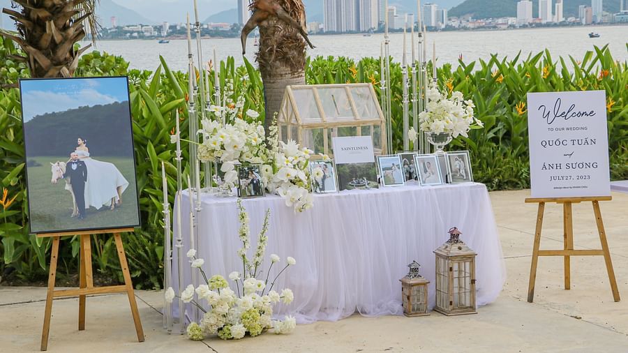 A corner at the outdoor where decorated tables and signboard are placed - Alibu Resort Nha Trang