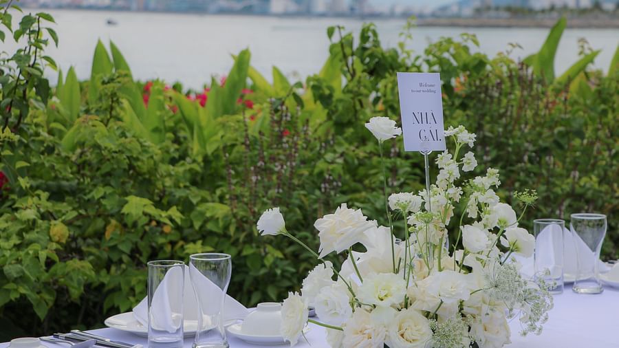 An image of a a table decorated by flowers  - Alibu Resort Nha Trang