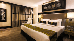 The Empresa Boutique Hotel - the king size bed offered by the Deluxe Room in Andheri