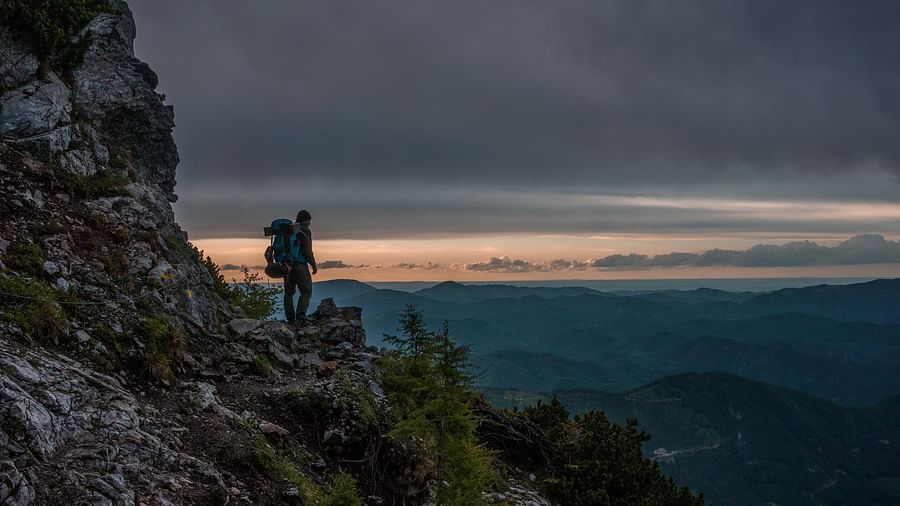 hiking on a rocky mountain terrain during sunset