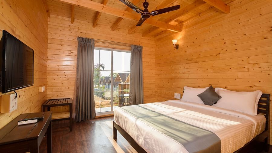 The wooden interiors of the bedroom - White Wood Resort, Morjim