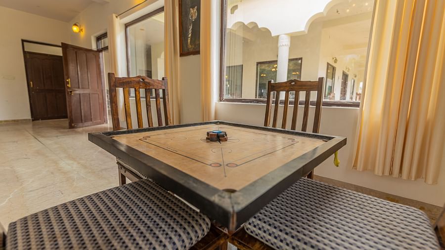 A corner angle of carrom board set up in a guest room at Clarks Inn Suites, Ranthambore.