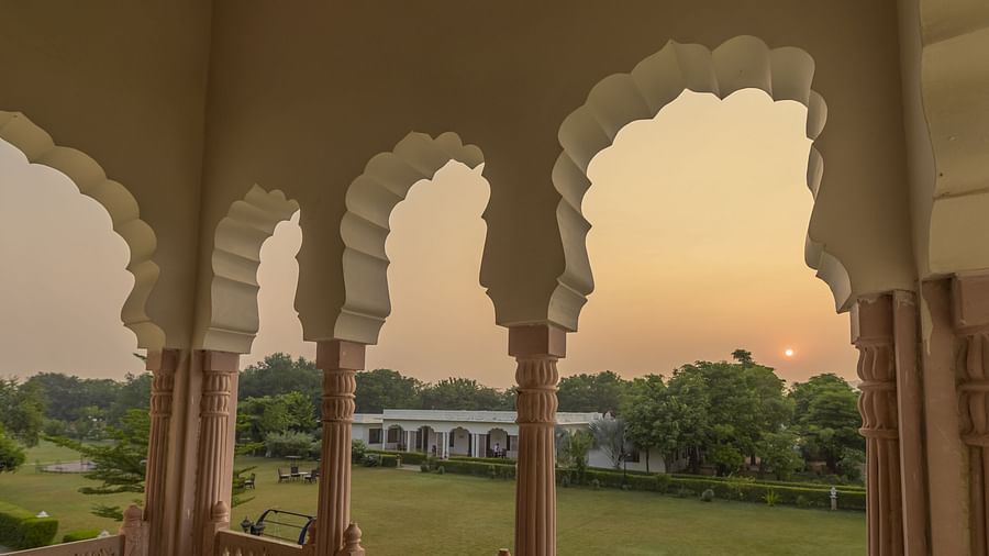 A view of the sunset through the arches at Clarks Inn Suites, Ranthambore.