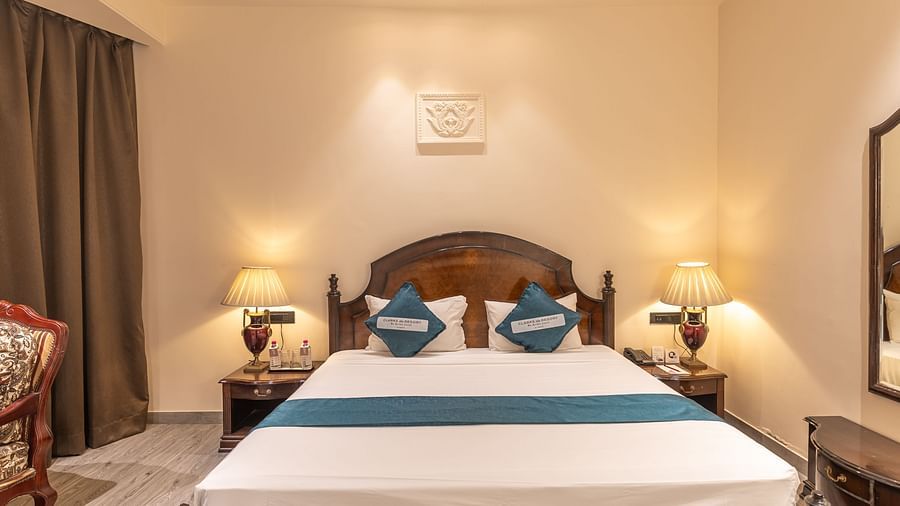 Double room with stylish decor and cosy lighting at Clarks Resort The Archi's Castle, Ajmer.
