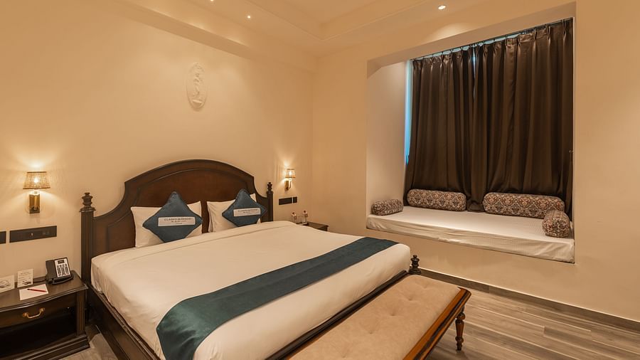 Cosy double room with window seating at Clarks Resort The Archi's Castle, Ajmer.