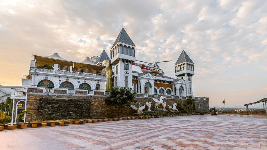 A facade view of the hotel with tiles layed in the foreground