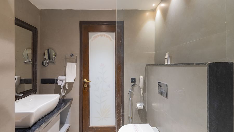 Modern bathroom with enclosed shower area at Clarks Resort The Archi's Castle, Ajmer.