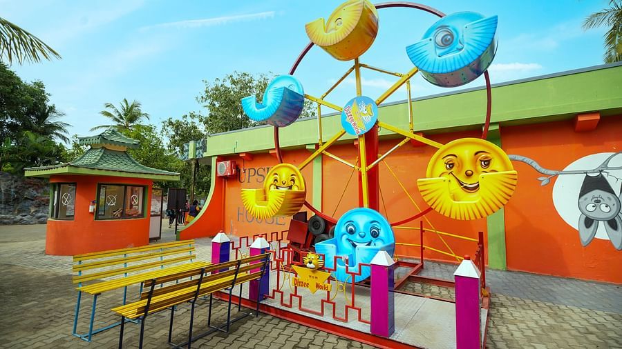A bright and playful photo zone at MGM Dizzee World decorated with large emoji cutouts and fun props, ideal for selfies and group pictures.