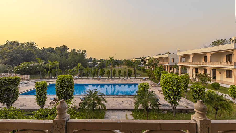 A view of the swimming pool and resort grounds at Clarks Inn Suites, Ranthambore.