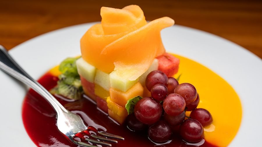 An image of a dessert with cherries and sauces placed on a white plate - S Hotel Montego Bay, Jamaica
