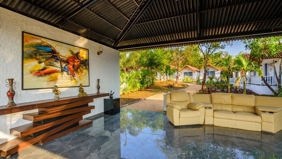Sofas inside the lobby at White Wood Resort, Morjim