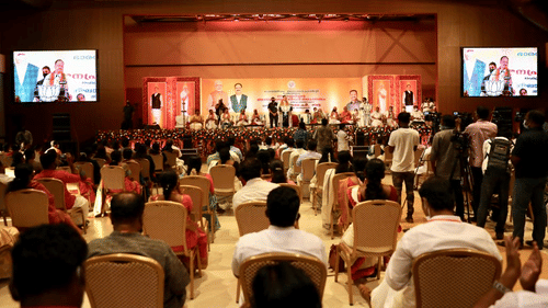 Audiences looking at the event being taken place on the stage at Uday Palace Convention Centre