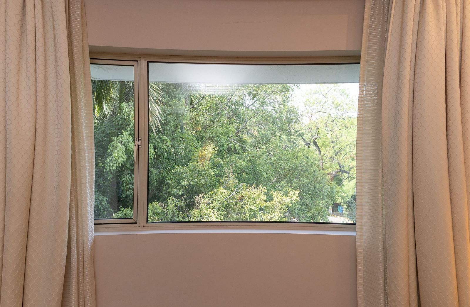 amazing lush green view from the window of the heritage parlour room - The Claridges New Delhi