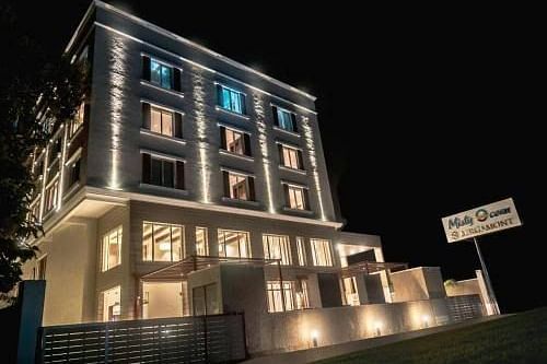 facade image of Misty Ocean, Pondicherry at night 