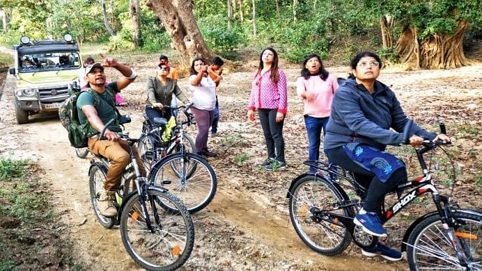 An image of a group of people riding bicycles