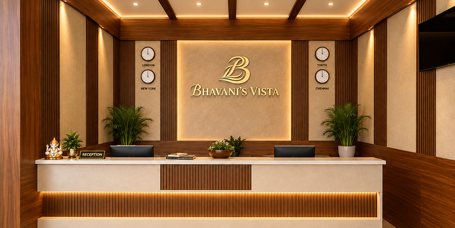 Modern front desk reception area with wooden paneling and warm ceiling lighting at Bhavani's Vista By Icon, Hosur.   