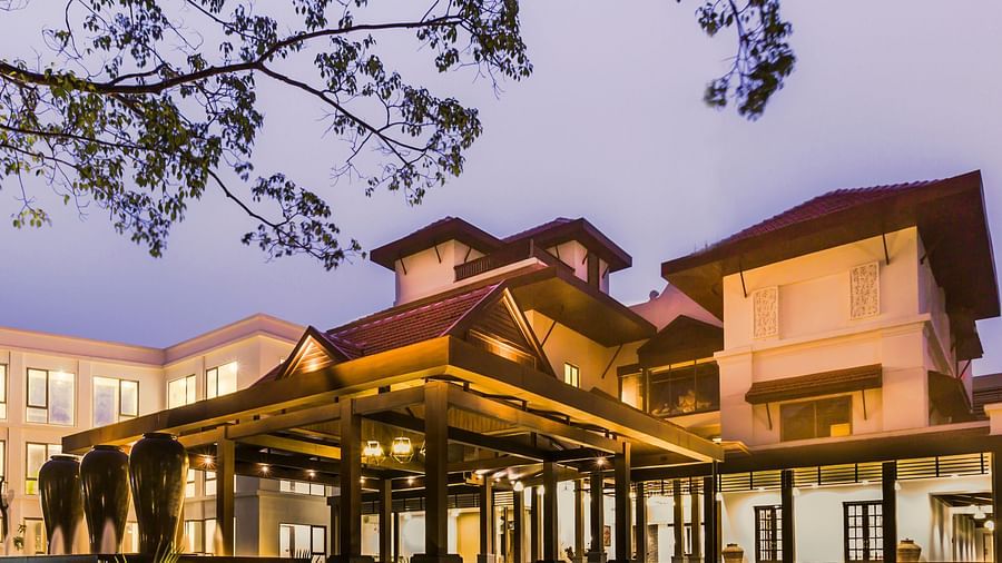 Resort facade lit with yellow lights - Rhythm Lonavala