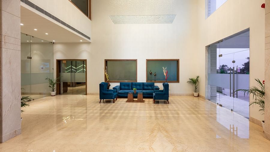 Sofas and chairs inside the lobby - The Orchid Hotel, Jamnagar