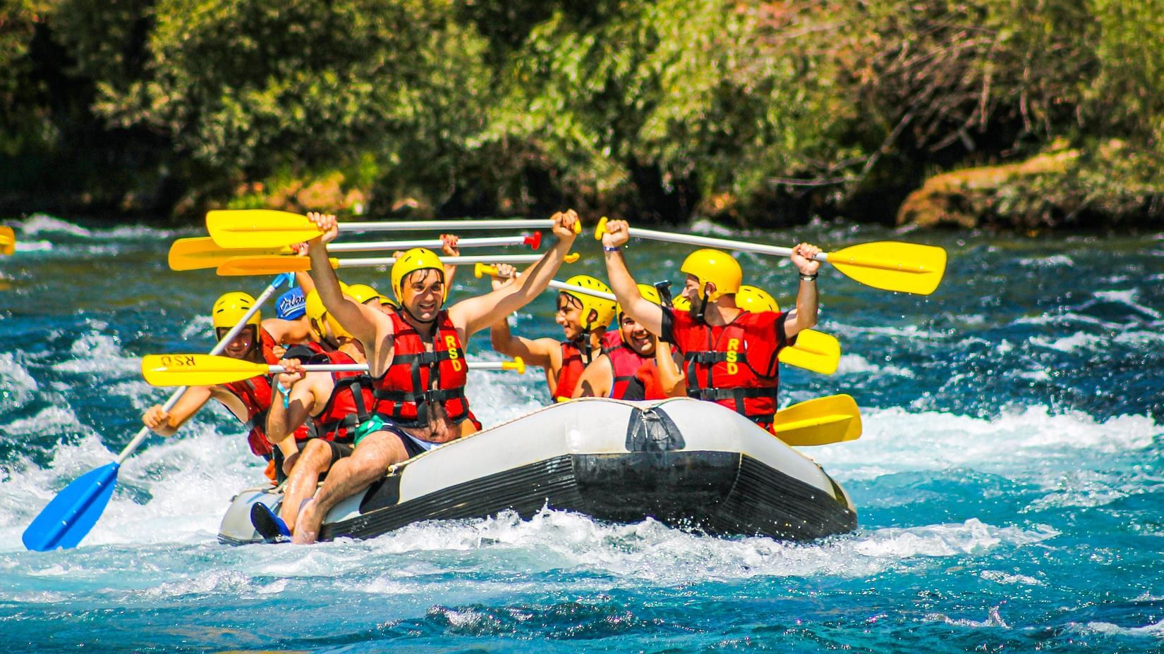 A group of people enjoying river rafting