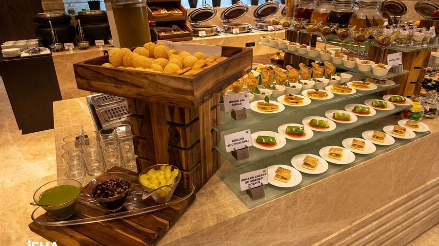 A close-up of a buffet display at The Gaurs Sarovar Premiere, highlighting the selection of appetizers, salads, or desserts.