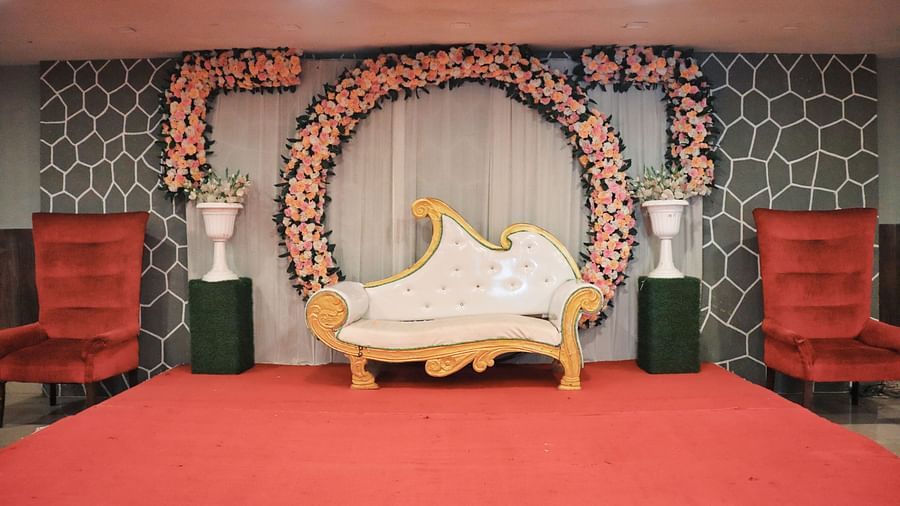 Stage adorned with flowers for an event at Clarks Collection, Bhavnagar