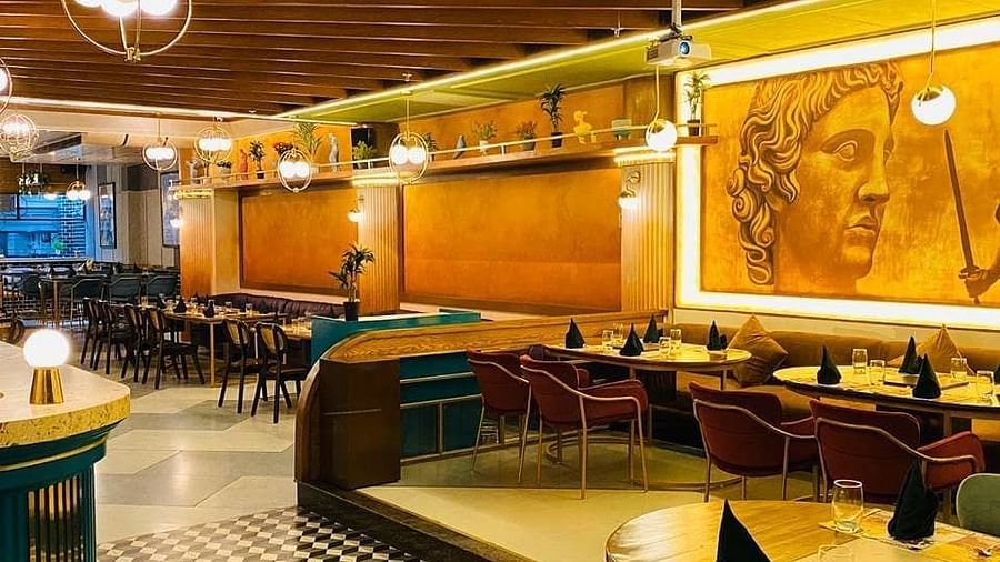 An image of chairs and tables and ceiling lights - Themis Barbecue House, Panipat