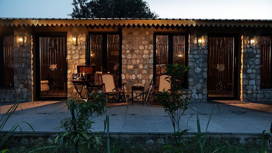 An image of a stone building in front of a small garden - Aalia Jungle Resort & Spa
