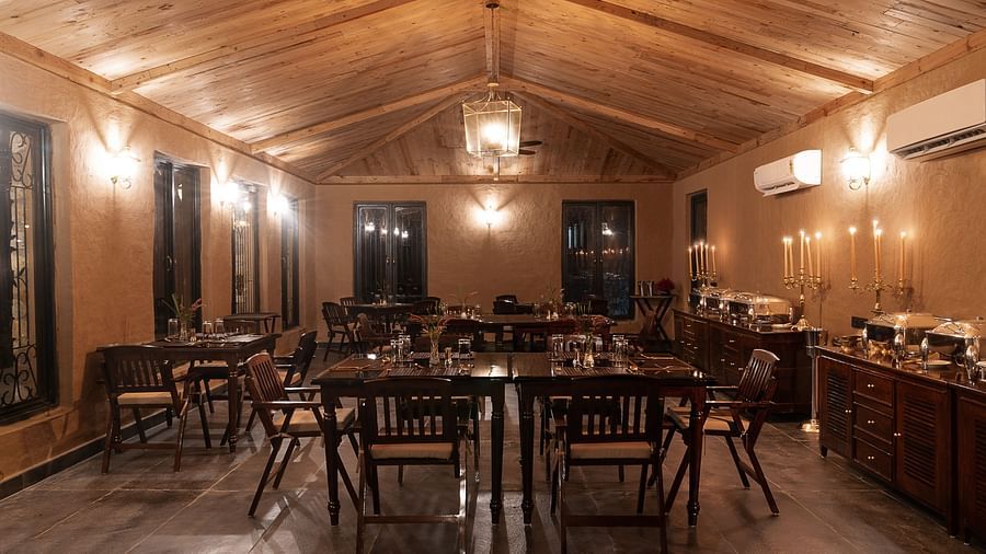 An image of our restaurant with ambient lighting - Aalia Jungle Resort & Spa