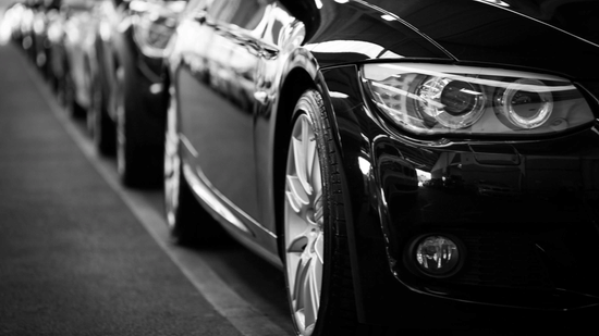 close up image of a car parked with several others in line a032c9f6