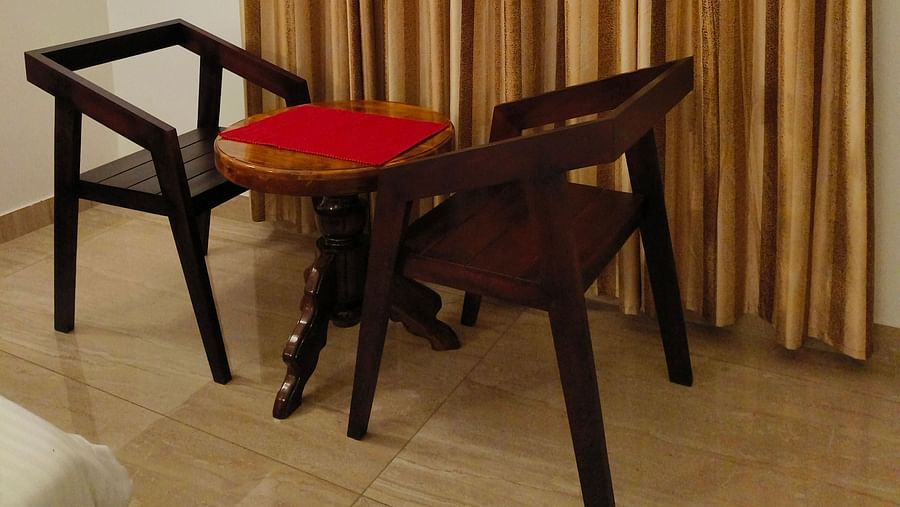Two chairs facing each other in 102 room at Ananda Holiday Home, Wayanad 6