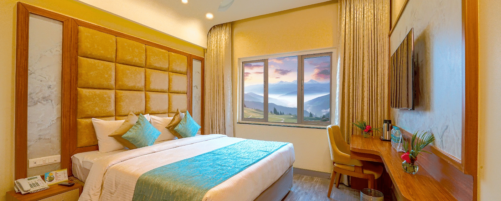 Cozy bedroom with a queen-sized bed, elegant headboard, and large window offering natural light Tara, Comfort Hotel in Hyderabad - Ramoji Film City.