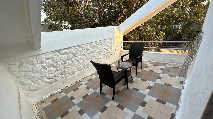Private balcony with seating, offering a peaceful retreat with scenic views – Maxxvalue Klub Klass Villa, Lonavala.
