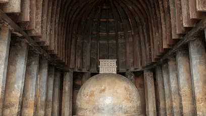 Stone-carved cave temple with vaulted ceiling and monolithic architecture.