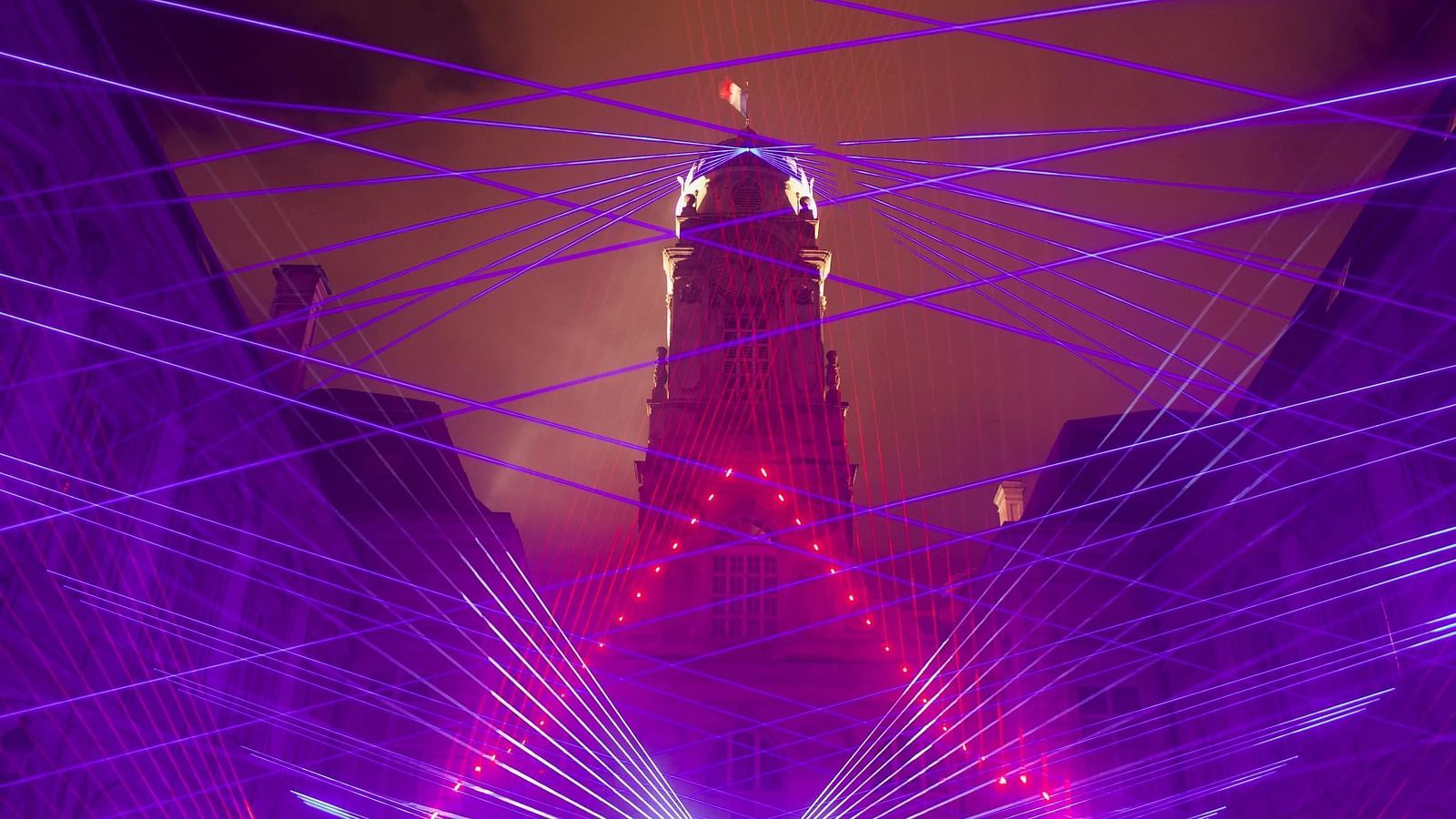 LED light and sound show in the night under open sky.