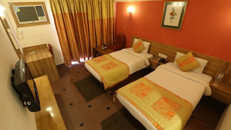 an aerial view of the twin beds inside the Deluxe room - VITS Kamats Resort, Silvassa