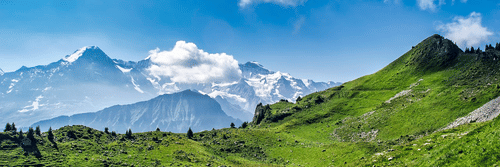 A scenic view of lush green mountains