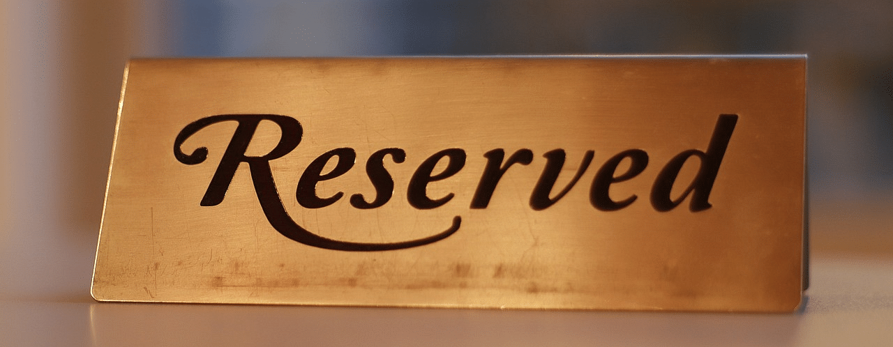 Wooden sign that says Reserved.