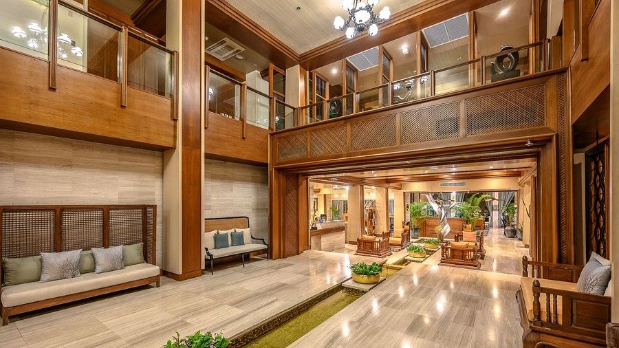 image of the lobby with a high ceiling and a chandelier hanging from above - Maikhao Dream Villa Resort & Spa, Phuket