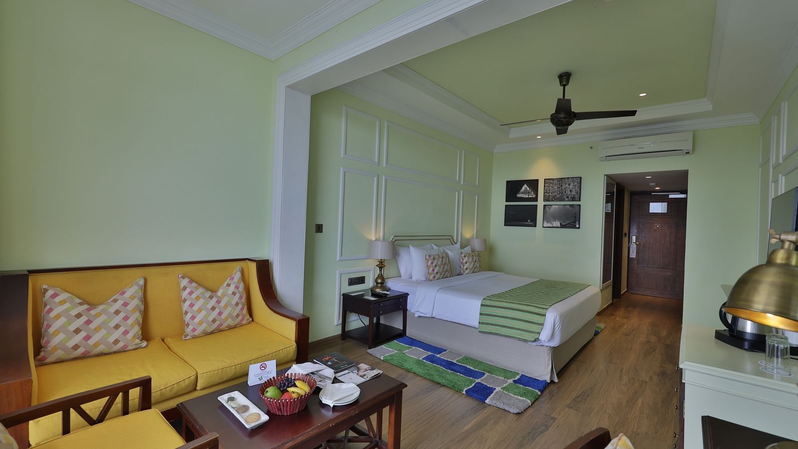 Standard Tropic Green Room with Partial Mountain View room with comfortable seating, dining area, and cozy ambiance at Fragrant Nature Munnar