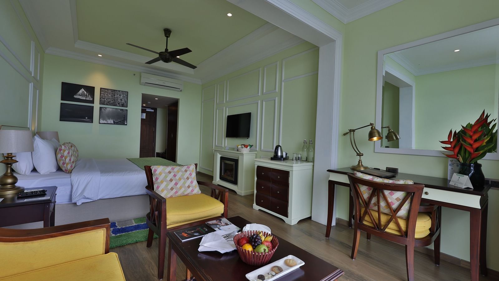 Standard Tropic Green Room with Partial Mountain View room with comfortable seating, dining area, and cozy ambiance at Fragrant Nature Munnar