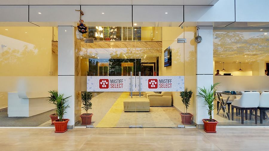 glass door entarnce with pots 