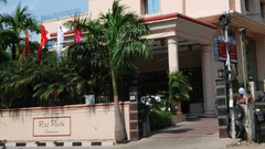 facade of Hotel raj Park, chennai with blue sky in the background