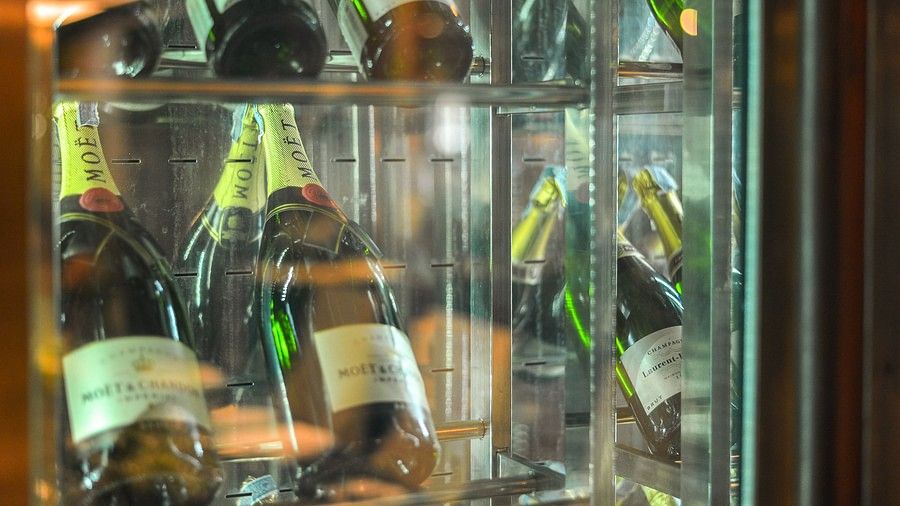 image featuring several wine bottles kept for display - Maikhao Dream Villa Resort & Spa, Phuket