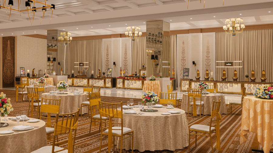 A convention hall with chairs, tables, and carpet. | Essentia Luxury Hotel and Convention, Nagpur