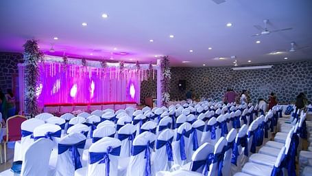 An image of a gazebo with seating arrangement and lighting set up for an event - Great Trails Yercaud by GRT Hotels
