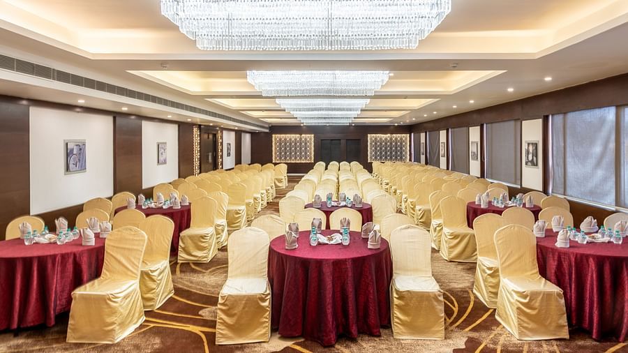 Banquet hall arranged with round tables and chairs, perfect for social or formal dining events